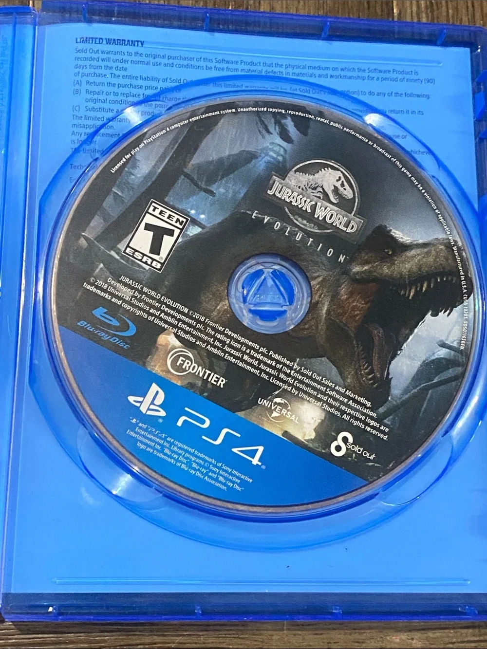 Sony PS4 Jurassic World Evolution - Blue Case with Black Cover Art